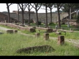 01885 ostia - regio ii - insula vii - piazzale delle corporazioni (ii,vii,4) - hintergrund theater.jpg